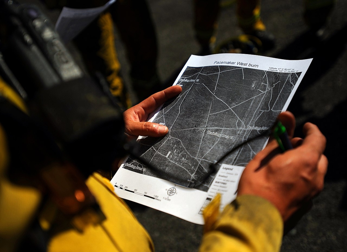 Firefighter studying a burn unit map Find a Training